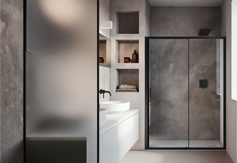 Ambiente bagno contract con box doccia con telaio nero in nicchia
