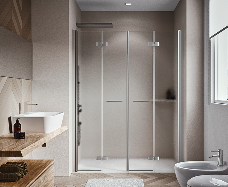 Niche shower enclosure with folding doors