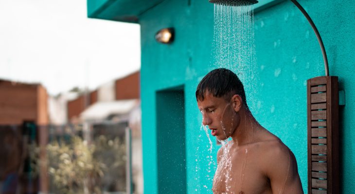 Man showering outdoors photo